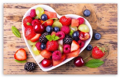heart bowl filled with fruit 